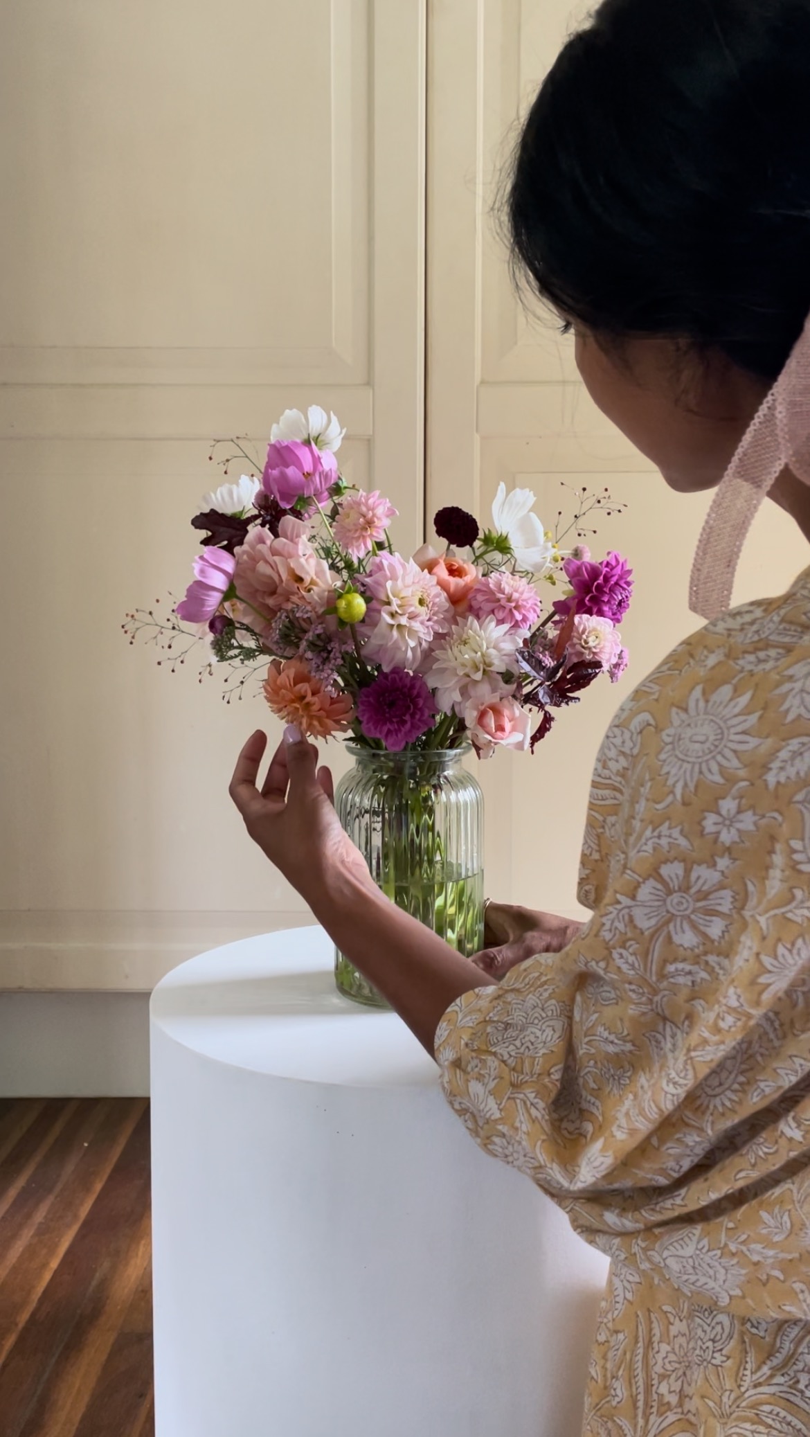 Flower Farmstead founder Jennifer Nini arranging organic flowers